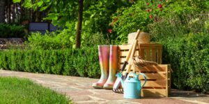 Wooden crates and gardening tools on stone path at backyard Wooden crates and gardening tools on stone path at backyard
